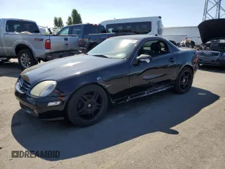 2001 Mercedes-Benz SLK-Class with VIN WDBKK65F71F175734, listed as a Copart auction lot 61874984 with 185,408 mi miles and Salvage Title. Bid and sale history available at carsss.com. Image 1.
