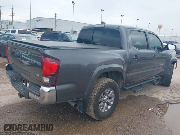 2018 Toyota Tacoma SR5 with VIN 5TFAZ5CN5JX062498, listed as a IAAI auction lot 41867393 with 128,879 mi miles and . Bid and sale history available at DreamBid. Image 4.