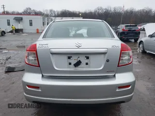 2011 Suzuki SX4 with VIN JS2YC5A41B6300385, listed as a IAAI auction lot 41570810 with 117,847 mi miles and . Bid and sale history available at DreamBid. Image 16.