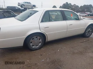 2002 Cadillac DeVille DHS z VIN 1G6KE57YX2U212020, wystawiony jako IAAI lot #41287342 z przebiegiem Nie podano mil oraz . Historia ofert i sprzedaży dostępna na DreamBid. Obrazek 13.