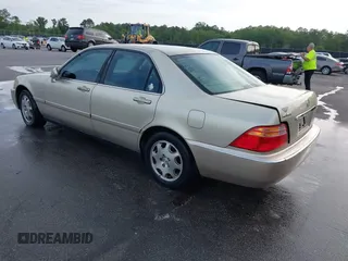1999 Acura RL with VIN JH4KA9660XC007723, listed as a IAAI auction lot 42039719 with Not provided miles and . Bid and sale history available at DreamBid. Image 3.