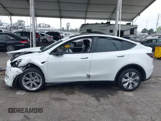 2022 Tesla Model Y Long Range with VIN 7SAYGDEE3NF518061, listed as a IAAI auction lot 41896233 with 34,714 mi miles and . Bid and sale history available at carsss.com. Image 14.