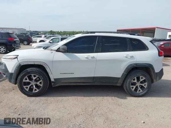 2015 Jeep Cherokee Trailhawk with VIN 1C4PJMBS6FW687718, listed as a IAAI auction lot 42505169 with 122,526 mi miles and . Bid and sale history available at DreamBid. Image 15.