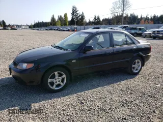 2003 Mazda Protege DX with VIN JM1BJ226231214537, listed as a Copart auction lot 54448615 with 147,753 mi miles and Salvage Title. Bid and sale history available at DreamBid. Image 1.