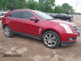 2012 Cadillac SRX Performance Collection z VIN 3GYFNBE34CS586414, wystawiony jako IAAI lot #41954611 z przebiegiem 197 314 mil mil oraz . Historia ofert i sprzedaży dostępna na DreamBid. Obrazek 1.