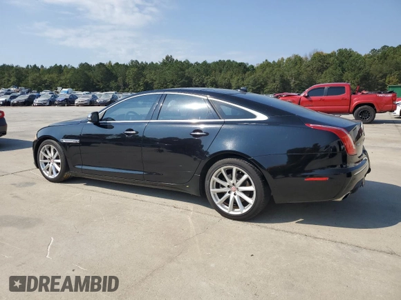 2015 Jaguar XJ with VIN SAJWA1CZ7F8V83167, listed as a Copart auction lot 74991144 with 94,502 mi miles and Salvage Title. Bid and sale history available at carsss.com. Image 2.