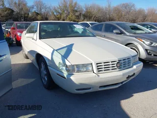 2000 Cadillac Eldorado Touring ETC z VIN 1G6ET1292YU188056, wystawiony jako IAAI lot #41671661 z przebiegiem 139 138 mil mil oraz . Historia ofert i sprzedaży dostępna na DreamBid. Obrazek 1.