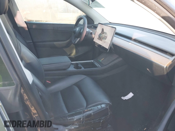 2022 Tesla Model Y Long Range with VIN 7SAYGAEE6NF361883, listed as a IAAI auction lot 41752441 with 50,493 mi miles and . Bid and sale history available at DreamBid. Image 5.
