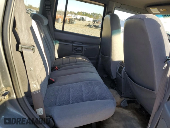1999 Ford Explorer XL with VIN 1FMZU34X8XUC31019, listed as a Copart auction lot 87831635 with 220,683 mi miles and Salvage title. Bid and sale history available at DreamBid. Image 11.