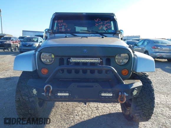 2010 Jeep Wrangler Unlimited Sahara with VIN 1J4BA5H14AL230604, listed as a IAAI auction lot 41884346 with 97,060 mi miles. Bid and sale history available at carsss.com. Image 6.