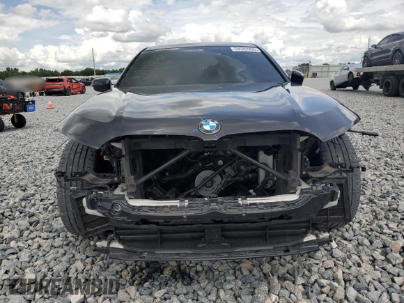 2021 BMW 7 Series 740i with VIN WBA7T2C01MCF78660, listed as a Copart auction lot 59582205 with 51,868 mi miles and Salvage title. Bid and sale history available at DreamBid. Image 5.