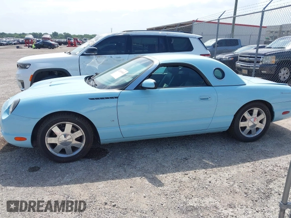 2003 Ford Thunderbird Deluxe z VIN 1FAHP60A53Y101461, wystawiony jako IAAI lot #42519933 z przebiegiem 64 820 mil mil oraz . Historia ofert i sprzedaży dostępna na DreamBid. Obrazek 14.