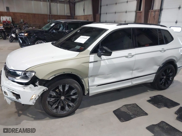 2020 Volkswagen Tiguan SE with VIN 3VV2B7AX1LM106600, listed as a IAAI auction lot 40259436 with 56,736 mi miles. Bid and sale history available at carsss.com. Image 6.