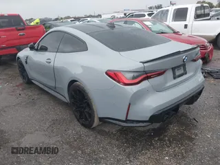 2021 BMW M4 Competition with VIN WBS33AZ03MCG59977, listed as a IAAI auction lot 41012387 with 50,572 mi miles. Bid and sale history available at carsss.com. Image 3.