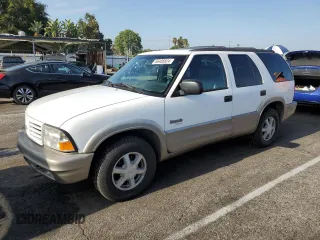 2000 Oldsmobile Bravada z VIN 1GHDT13W7Y2351268, wystawiony jako Copart lot #66408824 z przebiegiem 134 512 mil mil oraz Tytuł czysty. Historia ofert i sprzedaży dostępna na DreamBid. Obrazek 1.