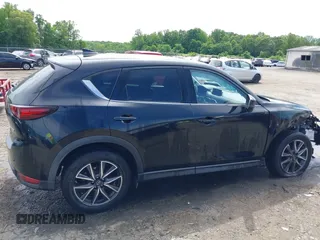 2018 Mazda CX-5 Grand Touring z VIN JM3KFBDM5J0307785, wystawiony jako IAAI lot #42302609 z przebiegiem 81 974 mil mil oraz . Historia ofert i sprzedaży dostępna na DreamBid. Obrazek 14.