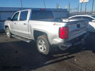 2014 Chevrolet Silverado 1500 LTZ with VIN 3GCUKSEC3EG400650, listed as a IAAI auction lot 41596087 with 127,240 mi miles. Bid and sale history available at carsss.com. Image 3.