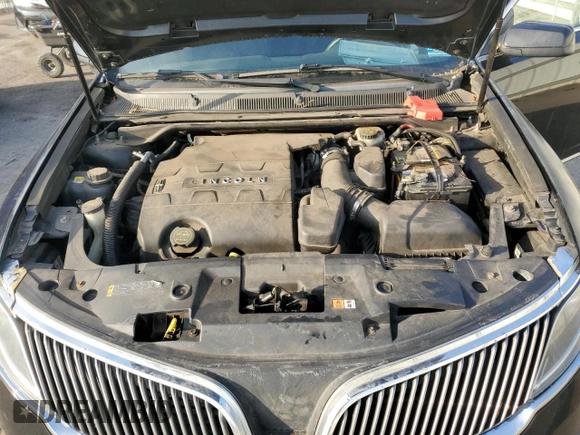 2016 Lincoln MKS z VIN 1LNHL9DK6GG601968, wystawiony jako Copart lot #43110935 z przebiegiem 304 439 mil mil oraz Szkoda całkowita • Salvage title. Historia ofert i sprzedaży dostępna na DreamBid. Obrazek 11.