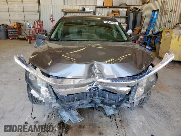 2012 Ford Fusion SE z VIN 3FAHP0HA1CR320160, wystawiony jako Copart lot #57597615 z przebiegiem 142 938 mil mil oraz Szkoda całkowita • Salvage title. Historia ofert i sprzedaży dostępna na DreamBid. Obrazek 5.