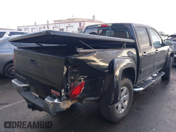 2010 GMC Canyon z VIN 1GTJSFDP6A8134412, wystawiony jako IAAI lot #41589150 z przebiegiem 164 232 mil mil oraz . Historia ofert i sprzedaży dostępna na DreamBid. Obrazek 4.