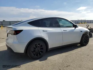 2022 Tesla Model Y Long Range with VIN 7SAYGDEE1NF559238, listed as a Copart auction lot 86744664 with 59,074 mi miles and Salvage Title. Bid and sale history available at carsss.com. Image 3.