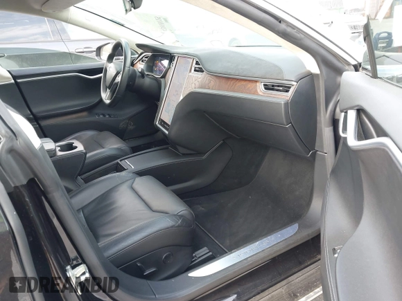 2017 Tesla Model S 100D with VIN 5YJSA1E28HF188981, listed as a IAAI auction lot 42010115 with 76,327 mi miles and . Bid and sale history available at DreamBid. Image 5.