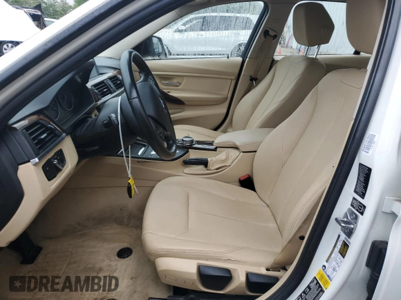 2014 BMW 3 Series 320i xDrive with VIN WBA3C3C51EF983592, listed as a Copart auction lot 60608765 with 195,061 mi miles and Salvage title. Bid and sale history available at DreamBid. Image 7.