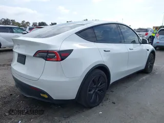 2021 Tesla Model Y Long Range with VIN 5YJYGDEE3MF081304, listed as a IAAI auction lot 42119270 with 90,521 mi miles. Bid and sale history available at carsss.com. Image 4.