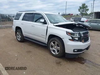 2020 Chevrolet Tahoe LT z VIN 1GNSCBKC4LR181887, wystawiony jako IAAI lot #42160821 z przebiegiem 106 757 mil mil oraz . Historia ofert i sprzedaży dostępna na DreamBid. Obrazek 1.