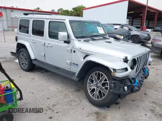 2023 Jeep Wrangler Sahara with VIN 1C4JJXP69PW608515, listed as a IAAI auction lot 42645282 with 27,112 mi miles and . Bid and sale history available at DreamBid. Image 1.