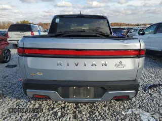 2023 Rivian R1T Adventure with VIN 7FCTGAAA2PN017170, listed as a Copart auction lot 77473014 with 28,821 mi miles and Salvage Title. Bid and sale history available at DreamBid. Image 6.