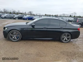 2013 BMW M5 with VIN WBSFV9C51DD095750, listed as a IAAI auction lot 40907304 with 93,014 mi miles. Bid and sale history available at carsss.com. Image 14.