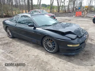 1995 Ford Probe z VIN 1ZVLT22B1S5104093, wystawiony jako IAAI lot #41744654 z przebiegiem 166 253 mil mil oraz . Historia ofert i sprzedaży dostępna na DreamBid. Obrazek 1.