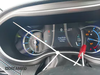 2021 Chrysler Pacifica Hybrid Touring L z VIN 2C4RC1L7XMR593987, wystawiony jako IAAI lot #41855966 z przebiegiem 72 685 mil mil oraz . Historia ofert i sprzedaży dostępna na DreamBid. Obrazek 7.