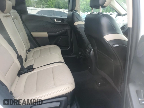 2020 Ford Escape Titanium z VIN 1FMCU9J9XLUB57675, wystawiony jako Copart lot #57777795 z przebiegiem Nie podano mil oraz Szkoda całkowita • Salvage title. Historia ofert i sprzedaży dostępna na DreamBid. Obrazek 11.