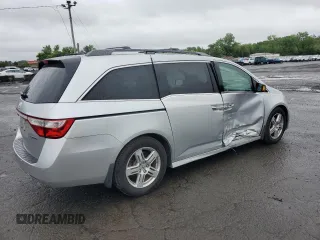 2011 Honda Odyssey Touring with VIN 5FNRL5H99BB021223, listed as a Copart auction lot 61171775 with 194,029 mi miles and Salvage title. Bid and sale history available at DreamBid. Image 3.