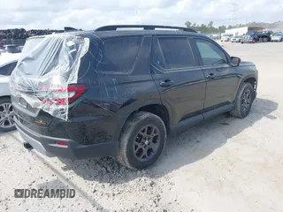2025 Honda Pilot TrailSport with VIN 5FNYG1H61SB026477, listed as a IAAI auction lot 41471719 with 12,624 mi miles and . Bid and sale history available at DreamBid. Image 4.