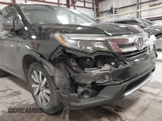 2019 Honda Pilot EX-L with VIN 5FNYF6H5XKB067858, listed as a IAAI auction lot 41643807 with 102,114 mi miles and . Bid and sale history available at carsss.com. Image 6.