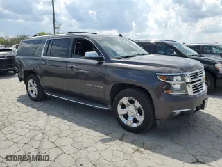 2015 Chevrolet Suburban LTZ with VIN 1GNSCKKCXFR216890, listed as a Copart auction lot 52695155 with 233,296 mi miles and Clean Title. Bid and sale history available at carsss.com. Image 4.
