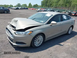 2015 Ford Fusion SE Hybrid z VIN 3FA6P0LU3FR163695, wystawiony jako IAAI lot #42428393 z przebiegiem 237 835 mil mil oraz . Historia ofert i sprzedaży dostępna na DreamBid. Obrazek 2.