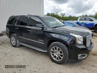 2015 GMC Yukon Denali with VIN 1GKS1CKJ0FR140877, listed as a Copart auction lot 50917985 with 180,726 mi miles and Salvage Title. Bid and sale history available at carsss.com. Image 4.