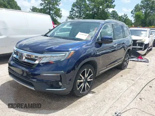 2022 Honda Pilot Touring 7-Passenger with VIN 5FNYF5H61NB019768, listed as a IAAI auction lot 42438780 with Not provided miles and . Bid and sale history available at DreamBid. Image 18.