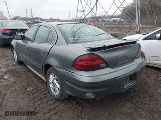 2004 Pontiac Grand Am SE with VIN 1G2NE52FX4M674634, listed as a IAAI auction lot 41547421 with 125,225 mi miles. Bid and sale history available at carsss.com. Image 3.