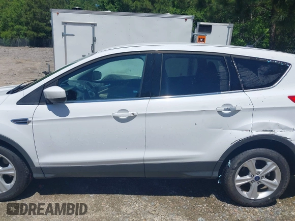 2014 Ford Escape SE with VIN 1FMCU9G90EUB76911, listed as a IAAI auction lot 42143518 with 123,466 mi miles and . Bid and sale history available at DreamBid. Image 14.