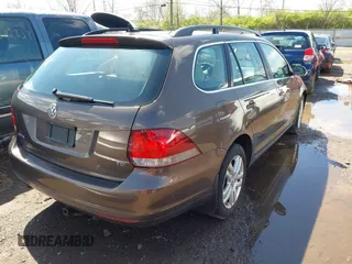 2011 Volkswagen Jetta SportWagen TDI with VIN 3VWPL7AJ2BM672287, listed as a IAAI auction lot 42013933 with 153,378 mi miles. Bid and sale history available at carsss.com. Image 4.