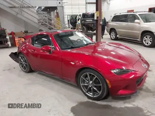 2019 Mazda MX-5 Miata Grand Touring z VIN JM1NDAM76K0305514, wystawiony jako IAAI lot #41378099 z przebiegiem 36 774 mil mil oraz . Historia ofert i sprzedaży dostępna na DreamBid. Obrazek 1.
