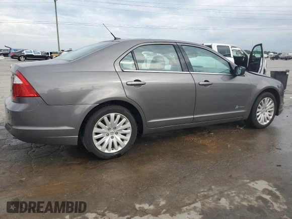 2012 Ford Fusion Hybrid z VIN 3FADP0L33CR211609, wystawiony jako Copart lot #60873005 z przebiegiem 144 474 mil mil oraz Szkoda całkowita • Salvage title. Historia ofert i sprzedaży dostępna na DreamBid. Obrazek 3.