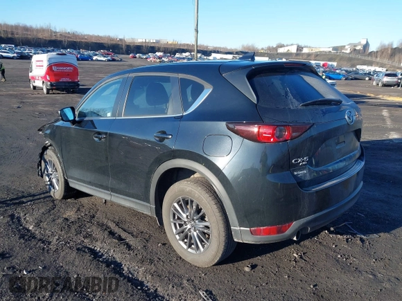 2021 Mazda CX-5 Touring with VIN JM3KFBCM2M1303063, listed as a IAAI auction lot 41814604 with 36,116 mi miles. Bid and sale history available at carsss.com. Image 3.