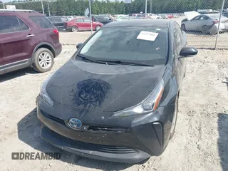 2021 Toyota Prius L Eco z VIN JTDKAMFU6M3141392, wystawiony jako IAAI lot #42317866 z przebiegiem 137 495 mil mil oraz . Historia ofert i sprzedaży dostępna na DreamBid. Obrazek 11.