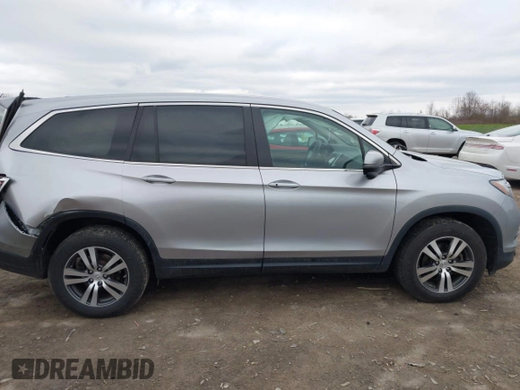 2017 Honda Pilot EX-L with VIN 5FNYF6H5XHB014067, listed as a IAAI auction lot 42083742 with 143,043 mi miles and . Bid and sale history available at DreamBid. Image 13.